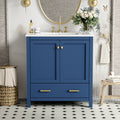 Blue bathroom vanity with white ceramic sink and soft-close doors — image 2